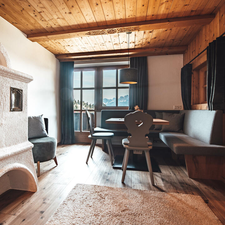 Sitzecke und Kaminofen Appartement Grosslehen