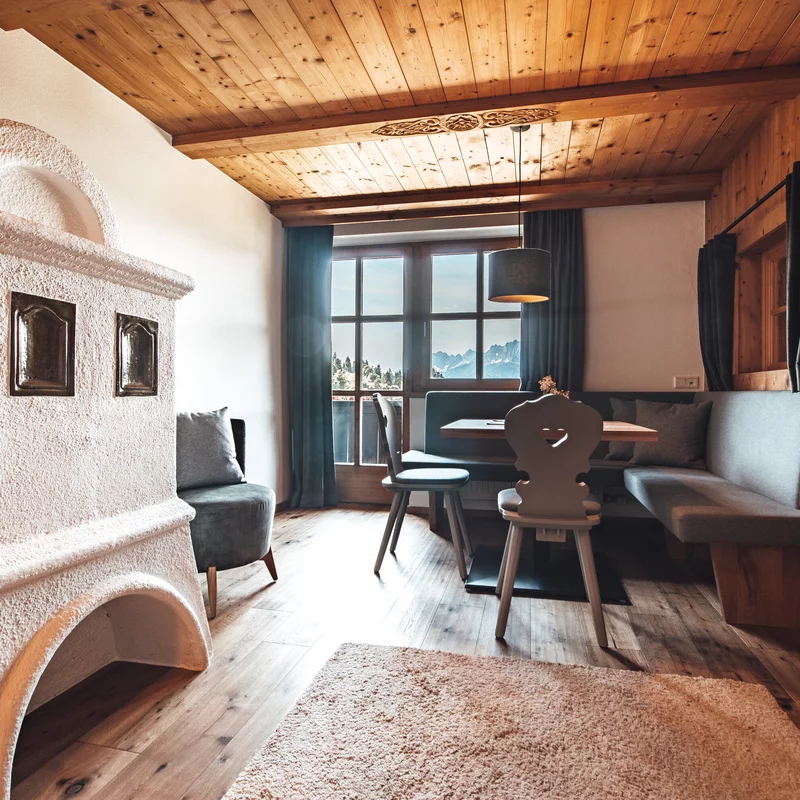 Sitzecke und Kaminofen Appartement Grosslehen