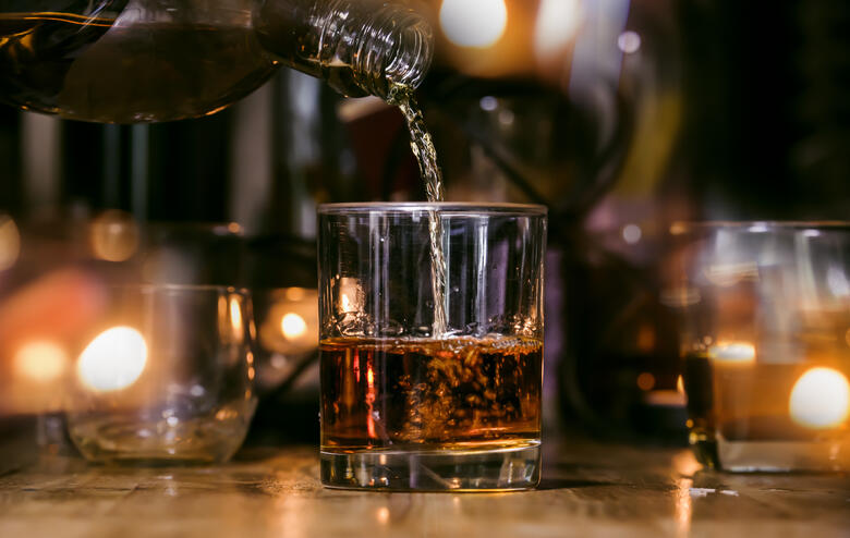 whiskey is served on wooden bar