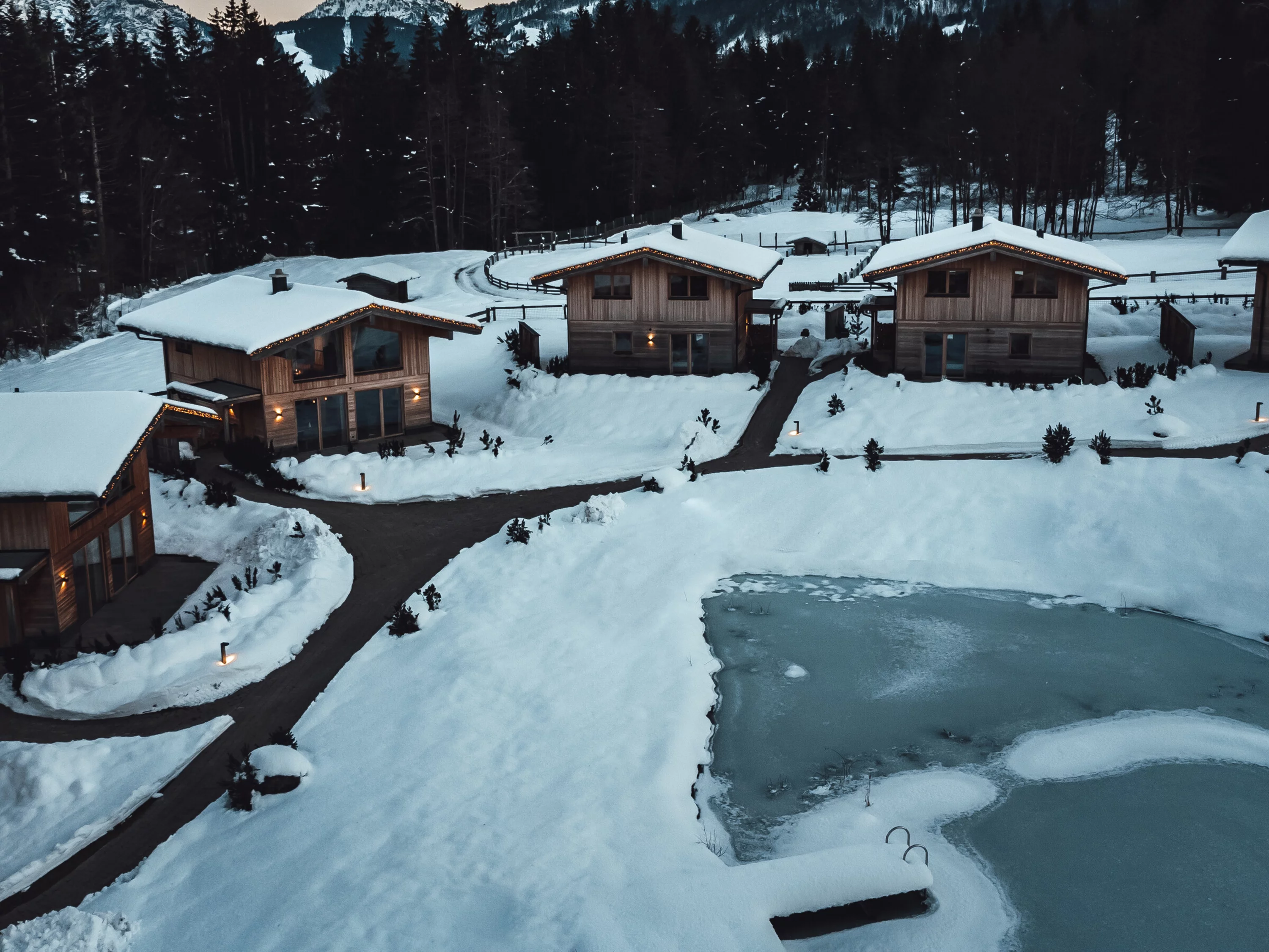 chalets exterior view with mountains in the background