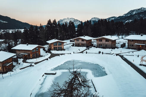 chalets exterior view with mountains in the background